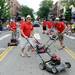 Members of the Redford Jaycees junior chamber dance with lawnmowers during the 23rd Annual Ann Arbor Jaycees Fourth of July Parade on Thursday, July 4, 2013 on South State Street in downtown Ann Arbor. Melanie Maxwell | AnnArbor.com